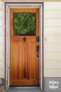 wood door with green wreath