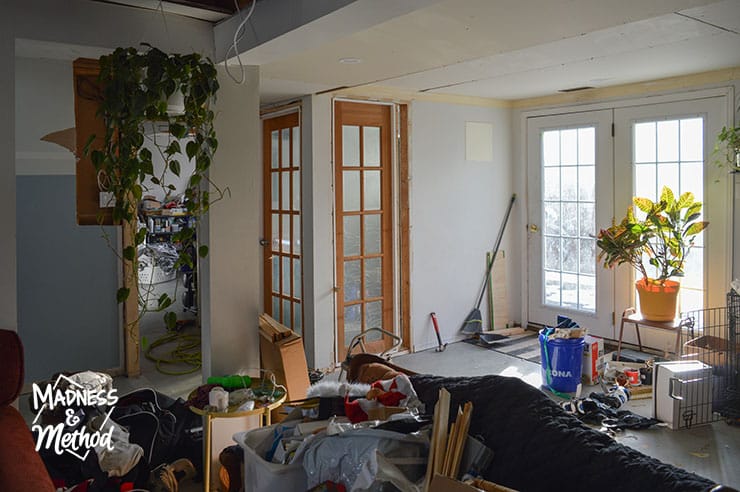 messy basement with glass doors