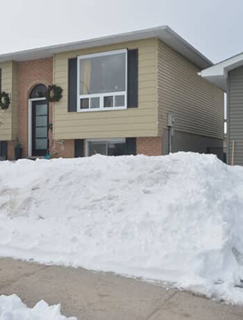 snowy raised ranch house