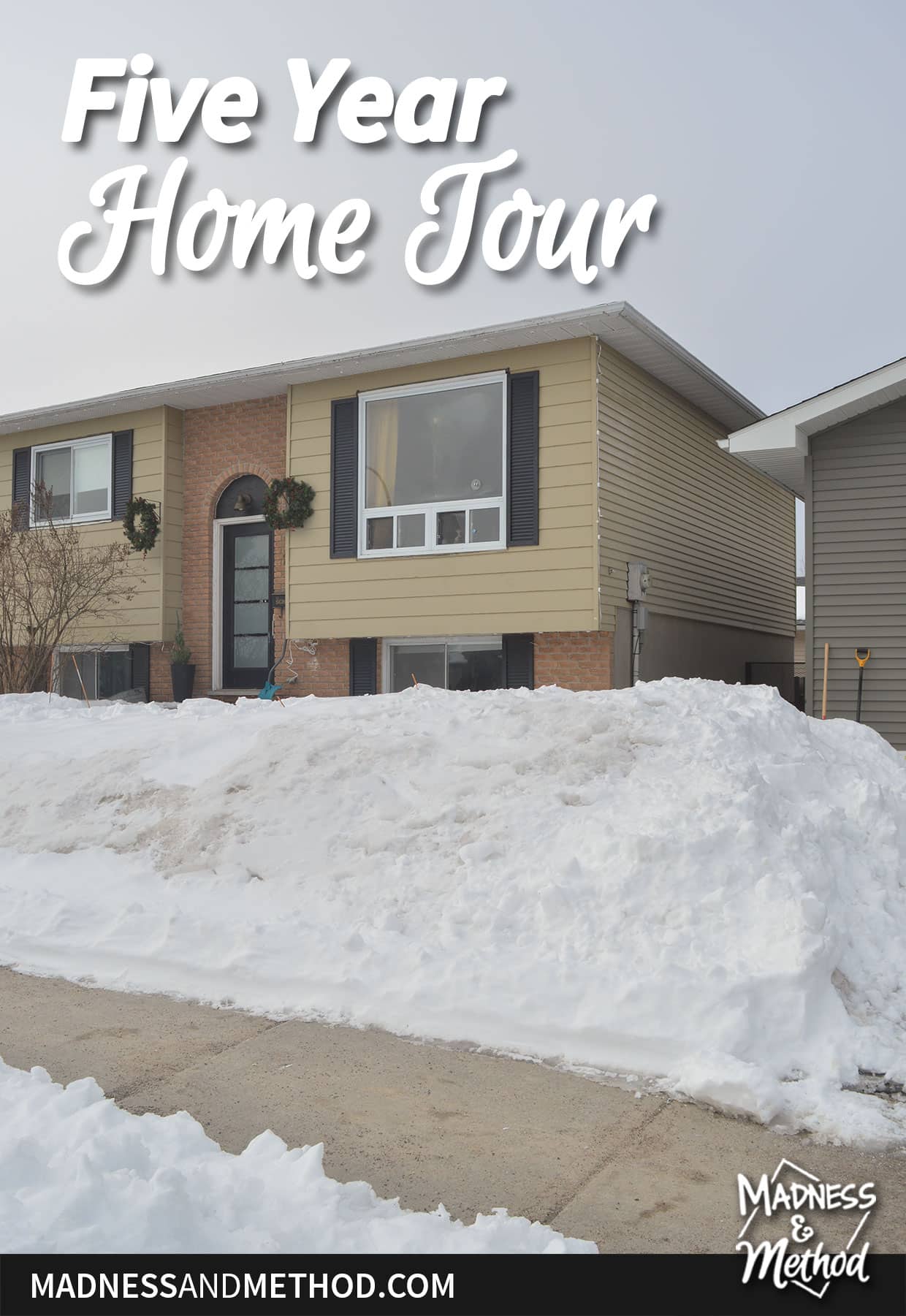 siding and brick raised ranch house in winter