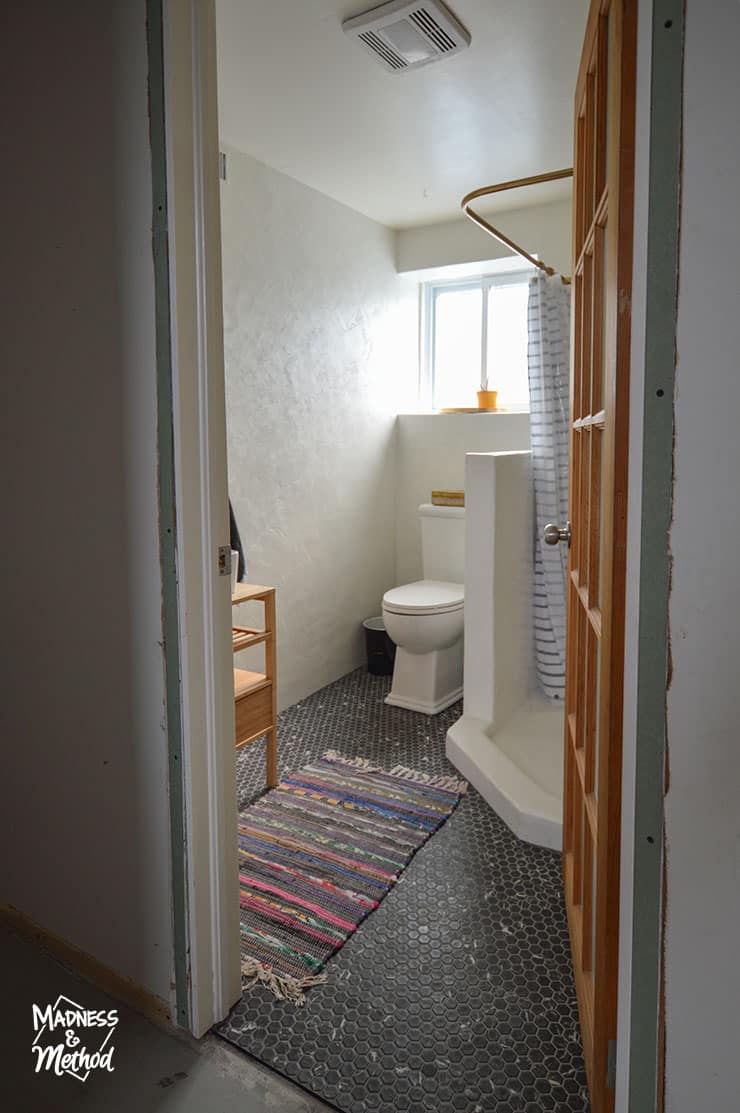 white bathroom with black floors