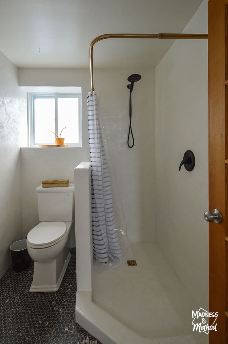 bathroom toilet next to shower