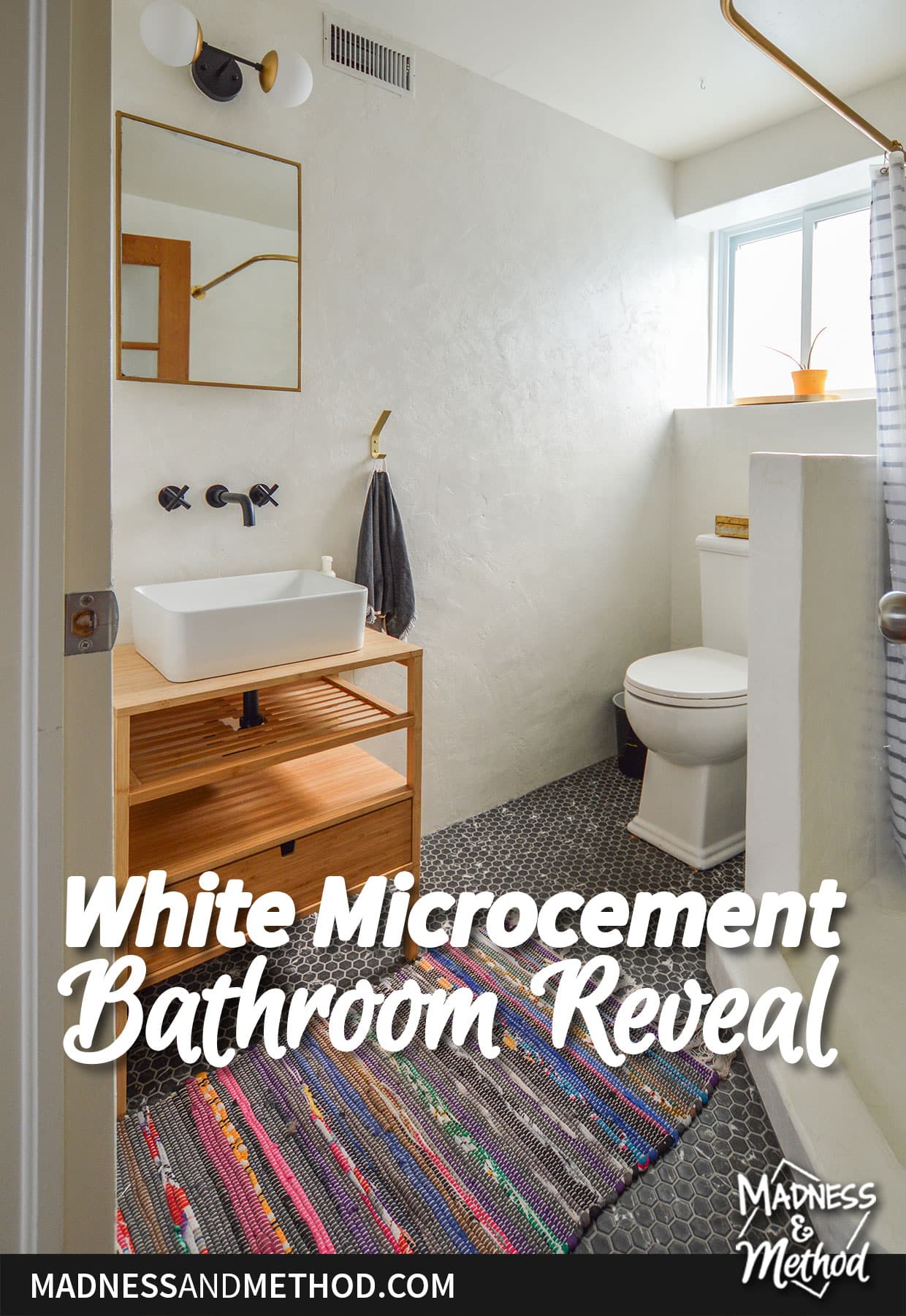 bathroom with window behind toilet
