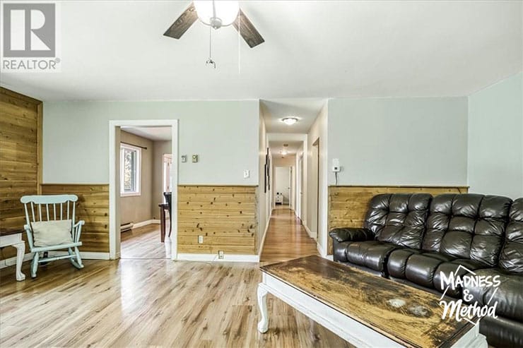living room entry with wood wainscoting